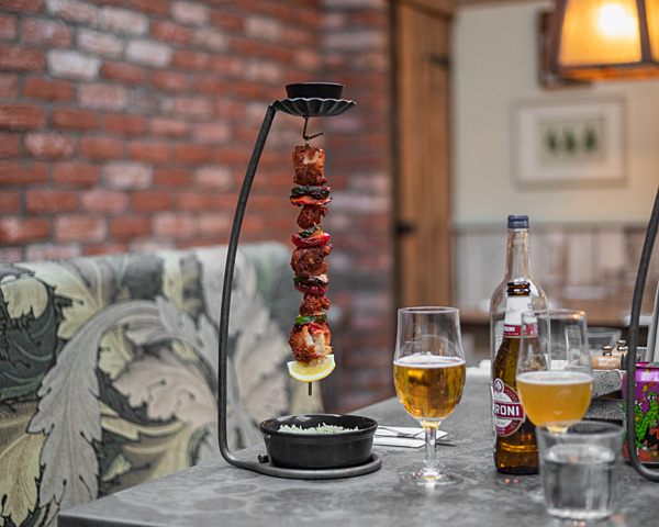 the botanist hanging kebab with rice and a bottle of peroni 