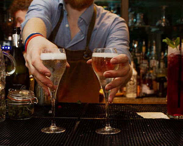 two glasses of prosecco freshly poured at the botanist