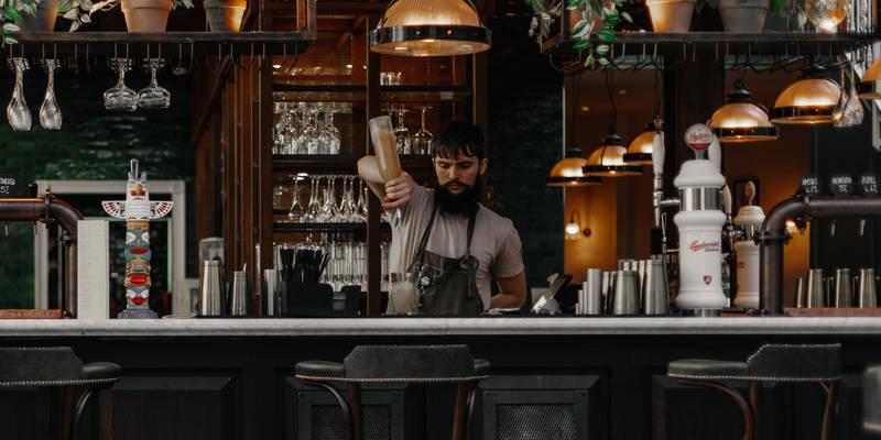 botanist bartender making cocktails at the bar