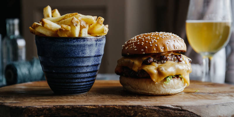 The Botanist cheeseburger served with properly seasoned chips